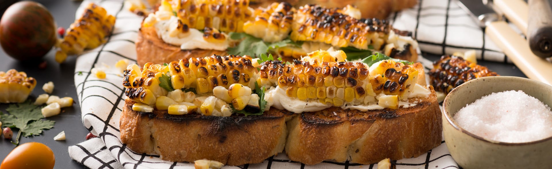 Corn toast appetizer on checkered linen