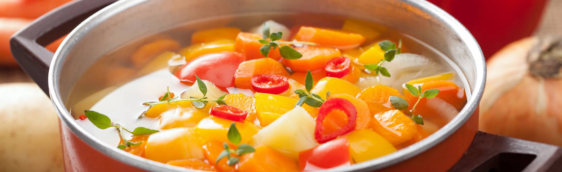 Vegetable soup with carrots, peppers, and thyme